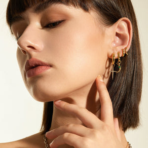 
            
                Load image into Gallery viewer, Gold Star Huggie Hoop Earrings
            
        